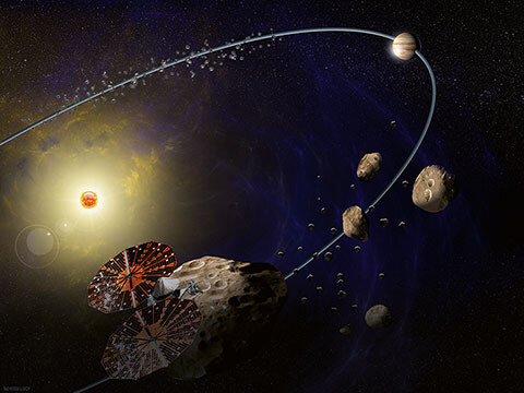 Vue d’artiste de la sonde Lucy et des troyens de Jupiter